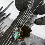 Turquoise Skull Pendants by Honeycomb Organics