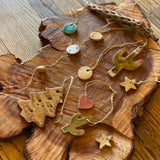 *Handmade Ceramic Ornaments by Spring + Vine*