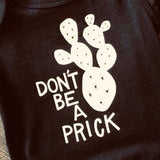 Don't Be a Prick Onesie by Lauren Waddell